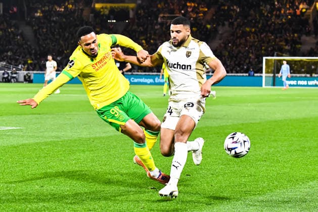FOOTBALL : FC Nantes vs RC Lens - Ligue 1 - JournÃ e 15 - 06 12 2025 Kelvin Amian (FC NANTES) Matthieu Udol (RC Lens) NantesFrance  Copyright: xBaptistexAutissierx