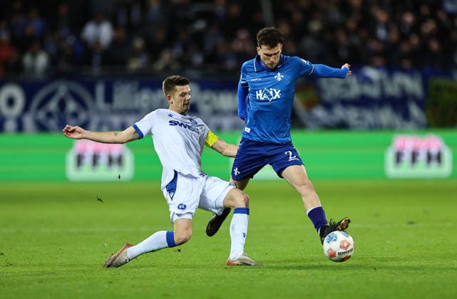 06.12.2025, Fussball 2. Bundesliga, SV Darmstadt 98 - Karlsruher SC, emonline, emspor, despor, v.l., Marvin Wanitzek (Karlsruher SC), Sergio Lopez (SV Darmstadt 98) DFL DFB REGULATIONS PROHIBIT ANY USE OF PHOTOGRAPHS AS IMAGE SEQUENCES AND OR QUASI-VIDEO. xdcx