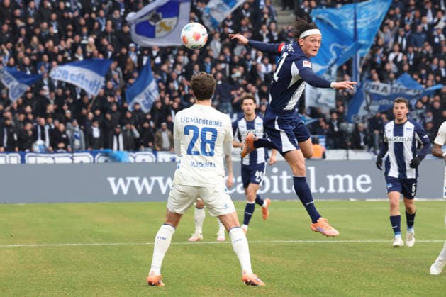 DEU, DFL, 2. FBL, Hertha BSC vs. 1: FC Magdeburg, 07.12.2025, Berliner Olympiastadion, Berlin, DEU, DFL, 2. FBL, Hertha BSC vs. 1: FC Magdeburg, im Bild Fabian Reese (Hertha BSC Berlin 11), Max Geschwill (1.FC Magdeburg 28) DFL - regulations prohibit any use of Photographs as image sequences and or quasi-video