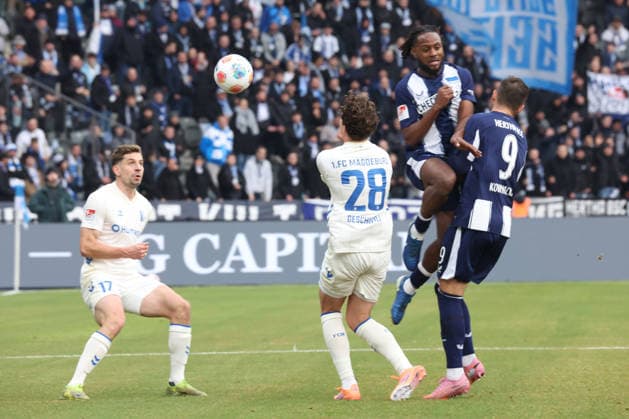 DEU, DFL, 2. FBL, Hertha BSC vs. 1: FC Magdeburg, 07.12.2025, Berliner Olympiastadion, Berlin, DEU, DFL, 2. FBL, Hertha BSC vs. 1: FC Magdeburg, im Bild Deyovaisio Zeefuik (Hertha BSC Berlin 42), Dawid Kownacki (Hertha BSC Berlin 9), Max Geschwill (1.FC Magdeburg 28), Alexander Nollenberger (1.FC Magdeburg 17) DFL - regulations prohibit any use of Photographs as image sequences and or quasi-video
