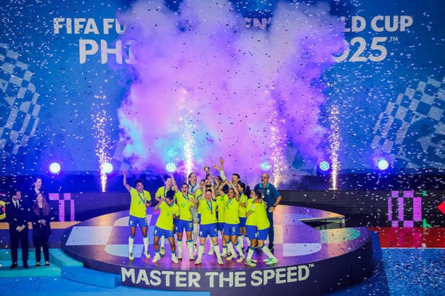 (251207) -- PASIG CITY, Dec. 7, 2025 -- Gold medalists team members of Brazil celebrate during the awarding ceremony at the FIFA Futsal Women s World Cup 2025 in Pasig City, the Philippines, Dec. 7, 2025. ) (SP)PHILIPPINES-PASIG CITY-FIFA FUTSAL WOMEN S WORLD CUP 2025-AWARDING CEREMONY ROUELLExUMALI 