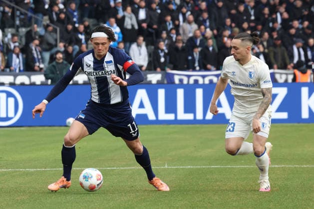 DEU, DFL, 2. FBL, Hertha BSC vs. 1: FC Magdeburg, 07.12.2025, Berliner Olympiastadion, Berlin, DEU, DFL, 2. FBL, Hertha BSC vs. 1: FC Magdeburg, im Bild Fabian Reese (Hertha BSC Berlin 11), Baris Atik (1.FC Magdeburg 23) DFL - regulations prohibit any use of Photographs as image sequences and or quasi-video