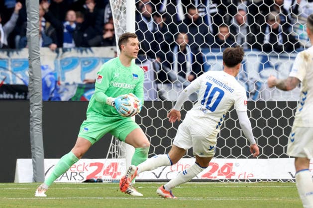 DEU, DFL, 2. FBL, Hertha BSC vs. 1: FC Magdeburg, 07.12.2025, Berliner Olympiastadion, Berlin, DEU, DFL, 2. FBL, Hertha BSC vs. 1: FC Magdeburg, im Bild Tjark Ernst (Hertha BSC Berlin 1), Noah Pesch (1.FC Magdeburg 10) DFL - regulations prohibit any use of Photographs as image sequences and or quasi-video