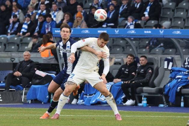 DEU, DFL, 2. FBL, Hertha BSC vs. 1: FC Magdeburg, 07.12.2025, Berliner Olympiastadion, Berlin, DEU, DFL, 2. FBL, Hertha BSC vs. 1: FC Magdeburg, im Bild Linus Gechter (Hertha BSC Berlin 44), Mateusz Zukowski (1.FC Magdeburg 22) DFL - regulations prohibit any use of Photographs as image sequences and or quasi-video