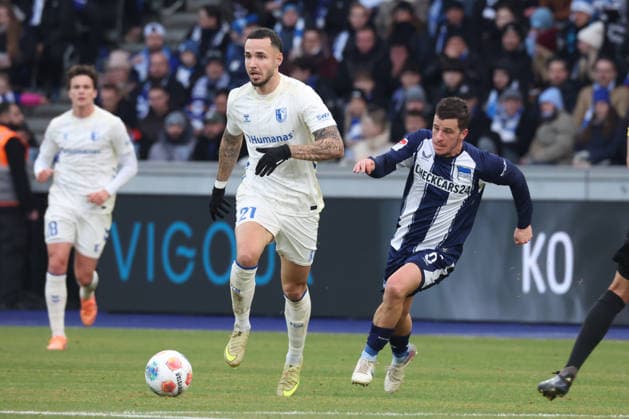DEU, DFL, 2. FBL, Hertha BSC vs. 1: FC Magdeburg, 07.12.2025, Berliner Olympiastadion, Berlin, DEU, DFL, 2. FBL, Hertha BSC vs. 1: FC Magdeburg, im Bild Diego Demme (Hertha BSC Berlin 6), Falko Michel (1.FC Magdeburg 21) DFL - regulations prohibit any use of Photographs as image sequences and or quasi-video