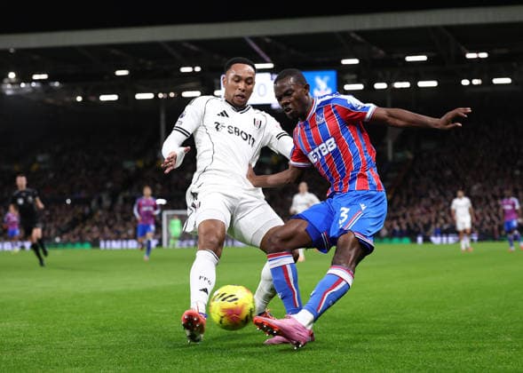 London, England, 7th December 2025. Kenny Tete of Fulham tackles Tyrick Mitchell of Crystal Palace during the Fulham vs Crystal Palace Premier League match at Craven Cottage, London. Picture credit should read: David Klein Sportimage EDITORIAL USE ONLY. No use with unauthorised audio, video, data, fixture lists, club league logos or live services. Online in-match use limited to 120 images, no video emulation. No use in betting, games or single club league player publications. SPI_027_DK_Fulham_Palace SPI-4355-0026