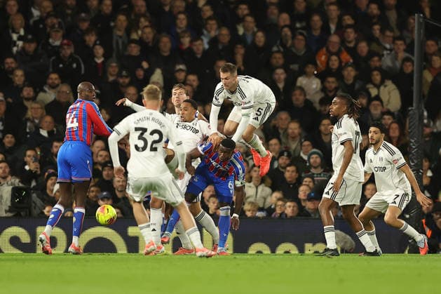7th December 2025; Craven Cottage, Fulham, London, England; Premier League Football, Fulham versus Crystal Palace; Joachim Andersen of Fulham jumps over Marc Guehi of Crystal Palace and Kenny Tete of Fulham to win a header  KatiexChan