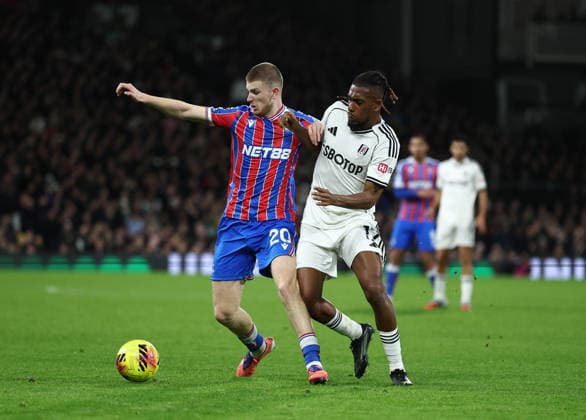 London, England, 7th December 2025. Adam Wharton of Crystal Palace tackled by Alex Iwobi of Fulham during the Fulham vs Crystal Palace Premier League match at Craven Cottage, London. Picture credit should read: David Klein Sportimage EDITORIAL USE ONLY. No use with unauthorised audio, video, data, fixture lists, club league logos or live services. Online in-match use limited to 120 images, no video emulation. No use in betting, games or single club league player publications. SPI_039_DK_Fulham_Palace SPI-4355-0038
