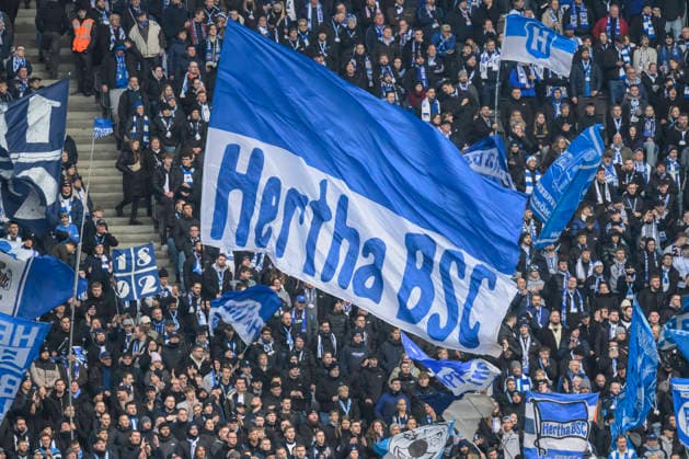GER, Berlin, soccer, Hertha BSC vs. 1. FC Magdeburg, DFB, 2nd Bundesliga, 2025 2026 season, f.l.t.r.: fans of Hetha, the Hertha fans raise their scarves and celebrate the team, flags and banner, DFB DFL REGULATIONS PROHIBIT ANY USE OF PHOTOGRAPHS AS IMAGE SEQUENCES AND OR QUASI-VIDEO, December 7, 2025, Copyright: HMBxMedia UwexKoch