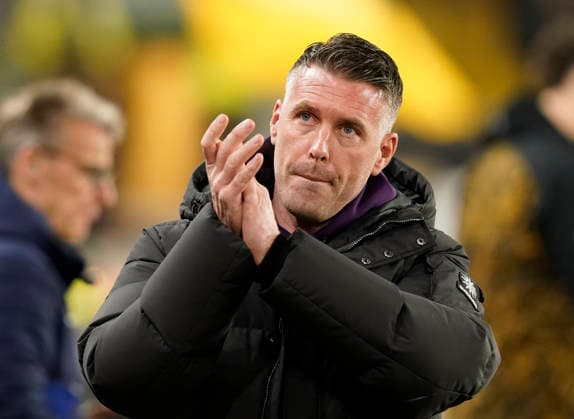 Wolverhampton, England, 8th December 2025. Rob Edwards manager of Wolverhampton Wanderers claps the fans during the Wolverhampton Wanderers vs Manchester United, ManU Premier League match at Molineux, Wolverhampton. Picture credit should read: Andrew Yates Sportimage EDITORIAL USE ONLY. No use with unauthorised audio, video, data, fixture lists, club league logos or live services. Online in-match use limited to 120 images, no video emulation. No use in betting, games or single club league player publications. SPI_035_AY_Wolves_Man_Utd SPI-4356-0035