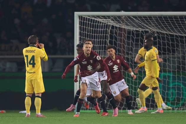 Turin, Italy, 8th December 2025. Nikola Vlasic of Torino FC celebrates with team mates after scoring a penalty to give the hosts a 1-0 lead during the Torino vs AC Milan Serie A match at Stadio Grande Torino, Turin. Picture credit should read: Jonathan Moscrop Sportimage EDITORIAL USE ONLY. No use with unauthorised audio, video, data, fixture lists, club league logos or live services. Online in-match use limited to 120 images, no video emulation. No use in betting, games or single club league player publications. SPI_004_JM_TORO_MILAN SPI-4323-0004