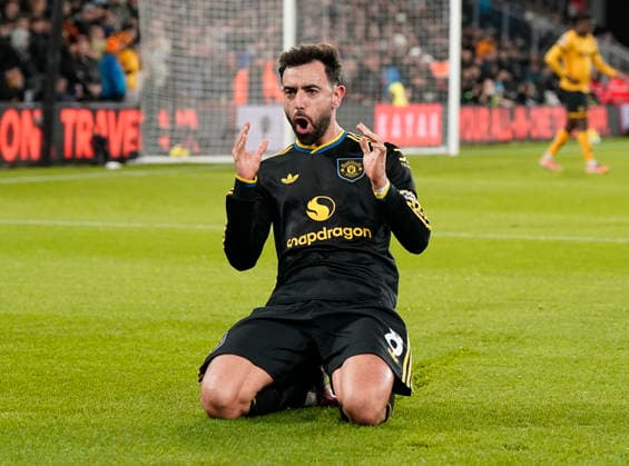 Wolverhampton, England, 8th December 2025. Bruno Fernandes of Manchester United, ManU celebrates scoring the first goal during the Wolverhampton Wanderers vs Manchester United Premier League match at Molineux, Wolverhampton. Picture credit should read: Andrew Yates Sportimage EDITORIAL USE ONLY. No use with unauthorised audio, video, data, fixture lists, club league logos or live services. Online in-match use limited to 120 images, no video emulation. No use in betting, games or single club league player publications. SPI_051_AY_Wolves_Man_Utd SPI-4356-0051