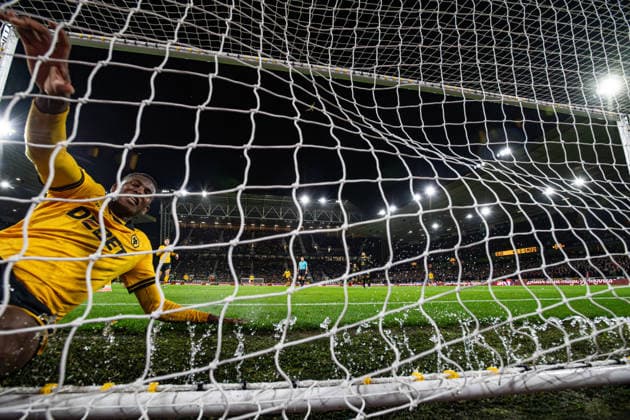 8th December 2025; Molineux Stadium, Wolverhampton, West Midlands, England; Premier League Football, Wolverhampton Wanderers versus Manchester United, ManU Yerson Mosquera of Wolverhampton Wanderers slides into the goal net after failing to stop the ball as Bruno Fernandes of Manchester United scores in the 25th minute to make the score 0-1  GodfreyxPitt