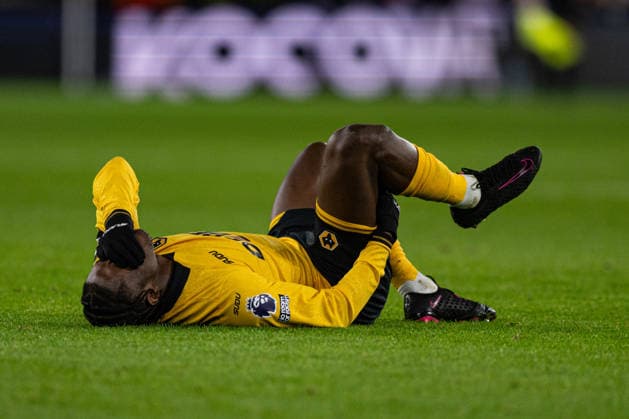 8th December 2025; Molineux Stadium, Wolverhampton, West Midlands, England; Premier League Football, Wolverhampton Wanderers versus Manchester United, ManU Jean Ricner Bellegarde of Wolverhampton Wanderers holds his hamstring in pain Editorial use only: DataCo restrictions apply See www.football-dataco.com  GodfreyxPitt
