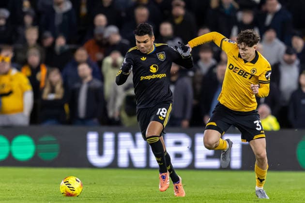 Wolverhampton Wanderers v Manchester United, ManU Premier League 08 12 2025. Manchester United midfielder Casemiro (18) battles for possession with Wolverhampton Wanderers defender Pedro Lima (37) during the Premier League match between Wolverhampton Wanderers and Manchester United at Molineux, Wolverhampton, England on 8 December 2025. Wolverhampton Molineux West Midlands England Editorial use only DataCo restrictions apply See www.football-dataco.com , Copyright: xManjitxNarotrax PSI-23361-0200