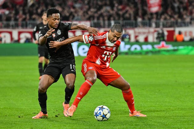 UEFA Champions League; FC Bayern München - Sporting CP; 09.12.2025 MUNICH, GERMANY - 09. DECEMBER: im Duell Geny CATAMO (Sporting CP 10) und Serge GNABRY (FC Bayern Munich 7) während dem Match zwischen dem FC Bayern München und Sporting Lissabon am 6. Spieltag der UEFA Champions League Ligaphase in der Allianz Arena Copyright: xBEAUTIFULxSPORTS Goldbergx
