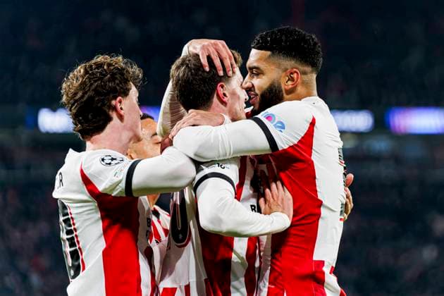 Guus Til of PSV Eindhoven celebrates with Ismael Saibari of PSV Eindhoven and Paul Wanner of PSV Eindhoven after scoring his teams first goal PSV Eindhoven v Atletico de Madrid, UEFA Champions League 2025 26 League Phase MD6, PSV Eindhoven v Atletico de Madrid, PSV Stadion, December 9, 2025, Eindhoven, Netherlands.