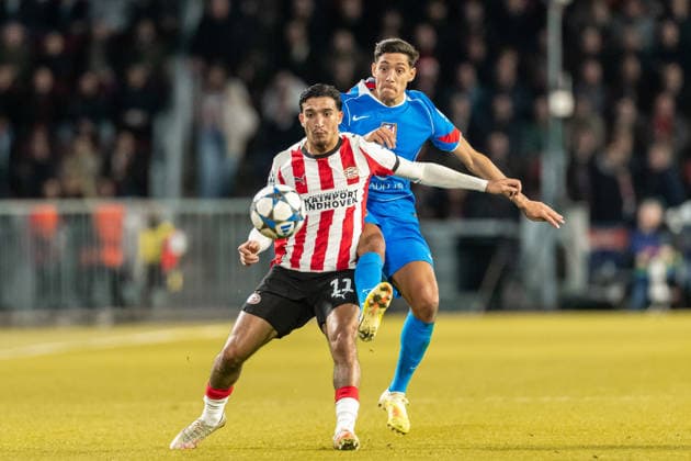 Couhaib Driouech (PSV Eindhoven) und Nahuel Molina (Atletico Madrid) battle for the ball during the UEFA Champions League 2025 26 League Phase MD6 match between PSV Eindhoven and Atletico de Madrid at PSV Stadion on December 9, 2025 in Eindhoven, Netherlands.