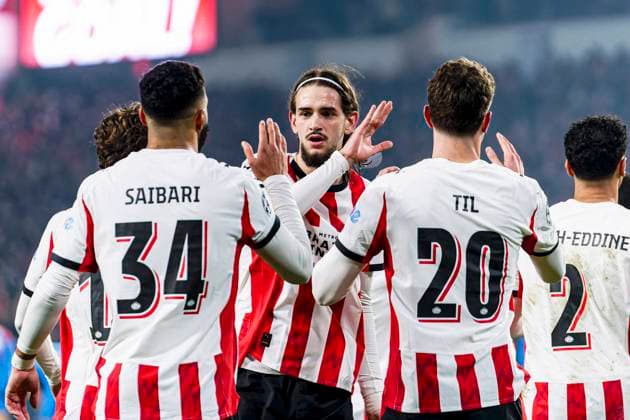 Guus Til of PSV Eindhoven celebrates with Ismael Saibari of PSV Eindhoven and Yarek Gasiorowski of PSV Eindhoven after scoring his teams first goal PSV Eindhoven v Atletico de Madrid, UEFA Champions League 2025 26 League Phase MD6, PSV Eindhoven v Atletico de Madrid, PSV Stadion, December 9, 2025, Eindhoven, Netherlands.