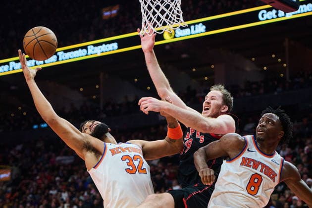 December 9, 2025, Toronto, On, Canada: Toronto Raptors Jakob Poeltl (19) is stopped at the net by New York Knicks Karl-Anthony Towns (32) and New York Knicks OG Anunoby (8) during first half NBA, Basketball Herren, USA basketball action in Toronto, on Tuesday, Dec. 9, 2025. Canada News - December 9, 2025 - ZUMAc35_ 20251209_zaf_c35_091 Copyright: xSammyxKoganx