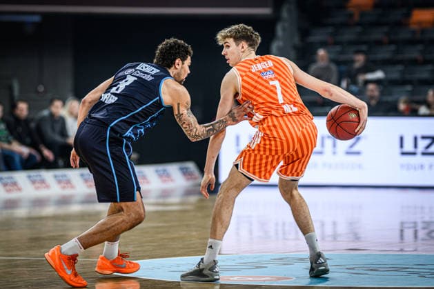 Jordan Usher (Turk Telekom Ankara) und Tobias Jensen (ratiopharm ulm) battle for the ball during the Basketball Eurocup match between ratiopharm ulm and Turk Telekom Ankara at ratiopharm Arena on December 10, 2025 in Neu-Ulm, Germany. (Photo by Harry Langer DeFodi Images)