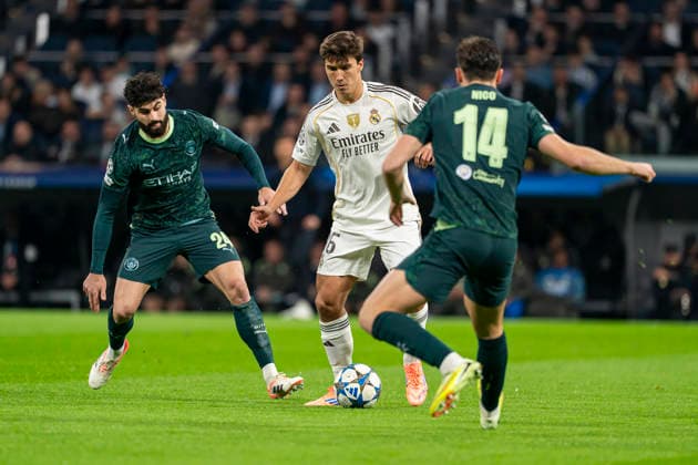 Real Madrid CF s Gonzalo Garcia (R) and Manchester City FC s Josko Guardiol during Champions League 2025 2026 match. December 10,2025. (20251210006)