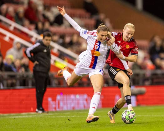 10th December 2025; Leigh Sports Village, Manchester, England; Womens Champions League Football, Manchester United, ManU versus Lyon Women; Julie Brand of OL Lyonnes under pressure from Anna Sandberg of Manchester United Women  TimxWilliams