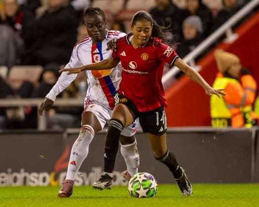 10th December 2025; Leigh Sports Village, Manchester, England; Womens Champions League Football, Manchester United, ManU versus Lyon Women; Jayde Riviere of Manchester United Women under pressure from Tabitha Chawinga of OL Lyonnes  TimxWilliams
