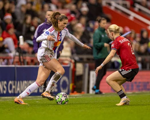 10th December 2025; Leigh Sports Village, Manchester, England; Womens Champions League Football, Manchester United, ManU versus Lyon Women; Julie Brand of OL Lyonnes under pressure from Anna Sandberg of Manchester United Women  TimxWilliams