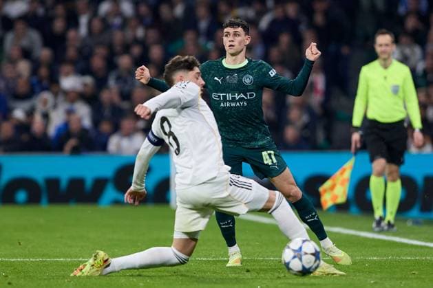 Phil Foden of Manchester City FC and Fede Valverde of Real Madrid CF Real Madrid v Manchester City, UEFA Champions League, Football, Estadio Santiago Bernabeu, Madrid, Spain - 10 Dec 2025Madrid Estadio Santiago Bernabu Spain EDITORIAL USE ONLY No use with unauthorised audio, video, data, fixture lists, club league logos or live services. Online in-match use limited to 120 images, no video emulation. No use in betting, games or single club league player publications. Copyright: xRubenxAlbarran Shutterstockx 16073023bp