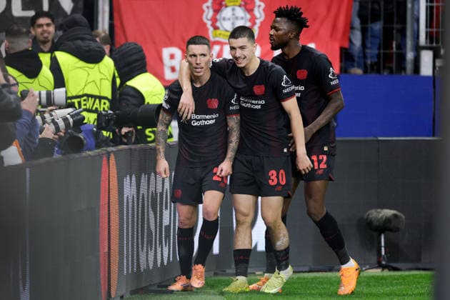 2025-12-10 Bayer 04 Leverkusen v Newcastle United FC - UEFA Champions League 2025 26 League Phase MD6 LEVERKUSEN, GERMANY - DECEMBER 10: Alejandro Grimaldo of Bayer 04 Leverkusen celebrates after scoring the team s second goal with Ibrahim Maza of Bayer 04 Leverkusen and Edmond Tapsoba of Bayer 04 Leverkusen during the UEFA Champions League 2025 26 League Phase MD6 match between Bayer 04 Leverkusen and Newcastle United FC at BayArena on December 10, 2025 in Leverkusen, Germany. Leverkusen BayArena Germany Content not available for redistribution in The Netherlands directly or indirectly through any third parties. Copyright: xJorisxVerwijstx