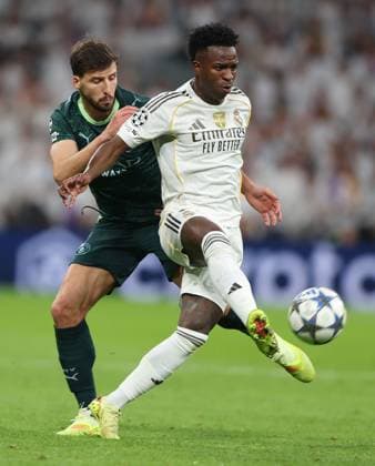 Vinicius Junior of Real Madrid and Ruben Dias of Manchester City in action Real Madrid v Manchester City, UEFA Champions League, Group Stage, Football, Bernabeu, Madrid, Spain - 10 Dec 2025Madrid Bernabeu Spain EDITORIAL USE ONLY No use with unauthorised audio, video, data, fixture lists, club league logos or live services. Online in-match use limited to 120 images, no video emulation. No use in betting, games or single club league player publications. Copyright: xKieranxMcManus Shutterstockx 16009961bw