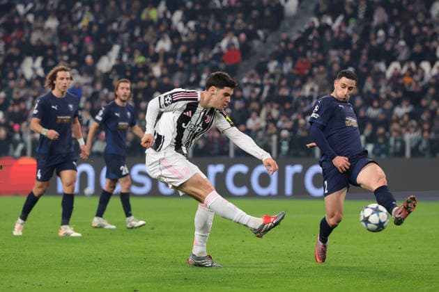 Turin, Italy, 10th December 2025. Kostas Pileas of Pafos FC attempts to block a shot from Vasilije Adzic of Juventus during the Juventus vs Pafos FC UEFA Champions League match at Juventus Stadium, Turin. Picture credit should read: Jonathan Moscrop Sportimage EDITORIAL USE ONLY. No use with unauthorised audio, video, data, fixture lists, club league logos or live services. Online in-match use limited to 120 images, no video emulation. No use in betting, games or single club league player publications. SPI_052_JM_JUVE_PAFOS_UCL SPI-4325-0052