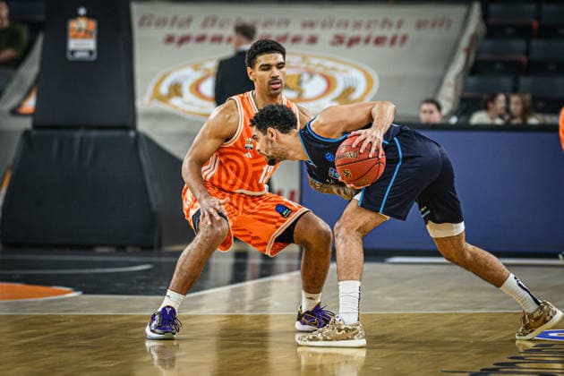 Mark Smith (ratiopharm ulm) und Michael Jaden Devoe (Turk Telekom Ankara) battle for the ball during the Basketball Eurocup match between ratiopharm ulm and Turk Telekom Ankara at ratiopharm Arena on December 10, 2025 in Neu-Ulm, Germany. (Photo by Harry Langer DeFodi Images)
