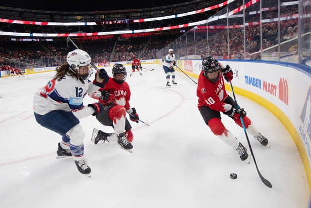 December 10, 2025, Edmonton, Ab, CANADA: United States Kelly Pannek (12) and Canada s Emily Clark (26) battle as Blayre Turnbull (40) picks up the puck during first period Rivalry Series action in Edmonton on Wednesday, December 10, 2025. Canada News - December 10, 2025  - ZUMAc35_ 20251210_zaf_c35_087 Copyright: xJasonxFransonx