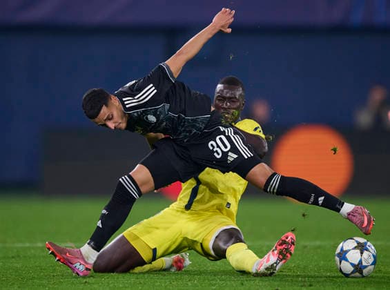 (251211) -- VILLARREAL, Dec. 11, 2025 () -- Elias Achouri (front) of Copenhagen and Pape Gueye of Villarreal vie for the ball during the UEFA Champions League football match between Villarreal and Copenhagen in Villarreal, Spain, on Dec. 10, 2025. (Str ) (SP)SPAIN-VILLARREAL-FOOTBALL-UEFA CHAMPIONS LEAGUE-VILLARREAL VS COPENHAGEN Xinhua 