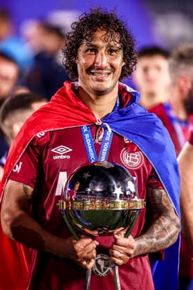 ASUNCION, PARAGUAY - NOVEMBER 22: Jose Canale of Lanus celebrates with a trophy after winning the 2025 Copa CONMEBOL Sudamericana final between Lanus and Atletico Mineiro at Estadio Defensores del Chaco on November 22, 2025 in Asuncion, Paraguay Lanus v Atletico Mineiro - Final Copa CONMEBOL Sudamericana 2025 Copyright: xx
