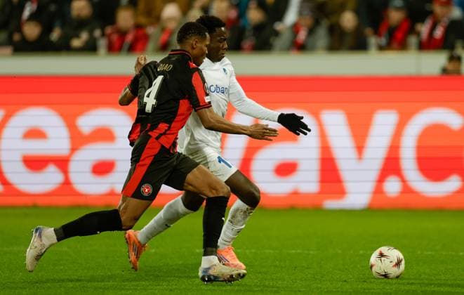 Midtjylland s Ousmane Diao and Genk s Robin Mirisola fight for the ball during a soccer game between Danish FC Midtjylland and Belgian KRC Genk, on Thursday 11 December 2025 in Herning, Denmark, on the sixth game (out of 8) in the league phase of the UEFA Europa League competition. LEONxGONZALES  x148221530x