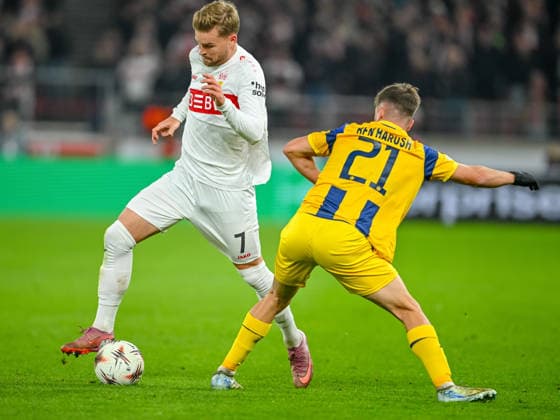Maximilian Mittelstädt (VfB Stuttgart) und Noam Ben Harosh (Maccabi Tel-Aviv FC) battle for the ball during the UEFA Europa League 2025 26 League Phase MD6 match between VfB Stuttgart and Maccabi Tel-Aviv FC at Stuttgart Arena on December 11, 2025 in Stuttgart, Germany. (Photo by Harry Langer DeFodi Images)