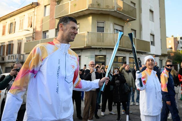 December 11, 2025, Pontedera, Rome, Italy: The Olympic Torch passes through Pontedera, the city of motors for the Milan Cortina 2026 Winter Olympics . Pontedera, Italy 11 December 2025 The Milan Cortina 2026 Olympic Torch.  - ZUMAa289 20251211_zia_a289_081 Copyright: xStefanoxDallexLuchex