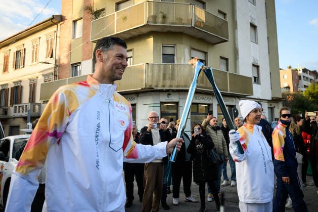 December 11, 2025, Pontedera, Rome, Italy: The Olympic Torch passes through Pontedera, the city of motors for the Milan Cortina 2026 Winter Olympics . Pontedera, Italy 11 December 2025 The Milan Cortina 2026 Olympic Torch.  - ZUMAa289 20251211_zia_a289_082 Copyright: xStefanoxDallexLuchex