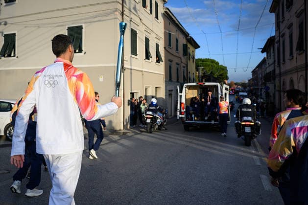 December 11, 2025, Pontedera, Rome, Italy: The Olympic Torch passes through Pontedera, the city of motors for the Milan Cortina 2026 Winter Olympics . Pontedera, Italy 11 December 2025 The Milan Cortina 2026 Olympic Torch.  - ZUMAa289 20251211_zia_a289_099 Copyright: xStefanoxDallexLuchex