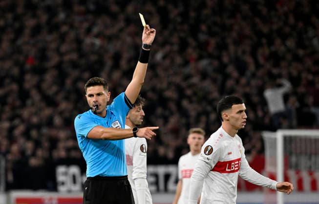 Schiedsrichter Referee Marian Barbu (ROU) zeigt Bilal El Khannouss VfB Stuttgart (11) gelbe Karte gelb Verwarnung Gestik Geste VfB Stuttgart vs Maccabi Tel-Aviv FC EUROPA LEAGUE EL 11.12.2025 DFL REGULATIONS PROHIBIT ANY USE OF PHOTOGRAPHS AS IMAGE SEQUENCES AND OR QUASI-VIDEO VfB Stuttgart vs Maccabi Tel-Aviv FC EUROPA LEAGUE EL