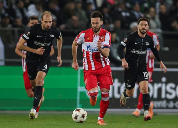 Sturm v Crvena Zvezda, UEFA Europa League, League phase, Matchday 6, season 2025 2026 Mirko Ivanic (C) of Crvena Zvezda in action against Jon Gorenc Stankovic (L) of Sturm Graz during the UEFA Europa League football match between Sturm Graz and Crvena Zvezda (Red Star) at Stadion Graz Liebenau on December 11. 2025. in Graz, Austria. Graz Austria Copyright: xPedjaxMilosavljevic STARSPORTx
