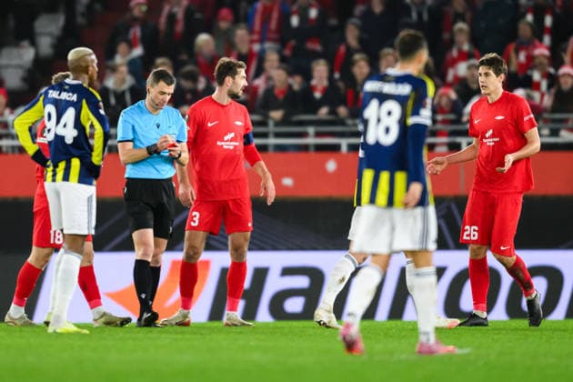 251211 Referee Willy Delajod and Eivind Helland of Brann during the UEFA Europa League football match between Brann and Fenerbache on December 11, 2025 in Bergen. Photo: Marius Simensen BILDBYRAN COP 238 MM0053 bbeng fotboll football soccer fotball uefa europa league brann fenerbache Copyright: MARIUSxSIMENSEN BB251211ZE029