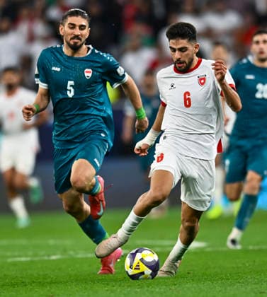 Jordan v Iraq : FIFA Arab Cup 2025 Amer Jamous of Jordan and Akam Hashim of Iraq in action during the FIFA Arab Cup 2025 Quarter-final match between Jordan and Iraq at Education City Stadium in Doha, Qatar, on December 12, 2025. DOHA Qatar Copyright: xNOUSHADxTHEKKAYILx
