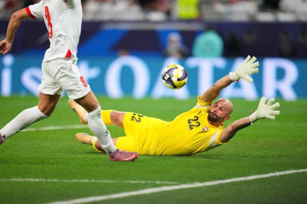 2025 FIFA Arab Cup in Doha, Qatar Goalkeeper Ahmed Basil of Iraq is beaten by a shot from Odeh Fakhoury of Jordan (L) but the goal was disallowed during the Quarterfinal football match between Jordan and Iraq in the 2025 FIFA Arab Cup at the Education City Stadium in Doha, Qatar on December 12, 2025. Doha Qatar  Copyright: xMatrixxImagesx xNicxBothmax