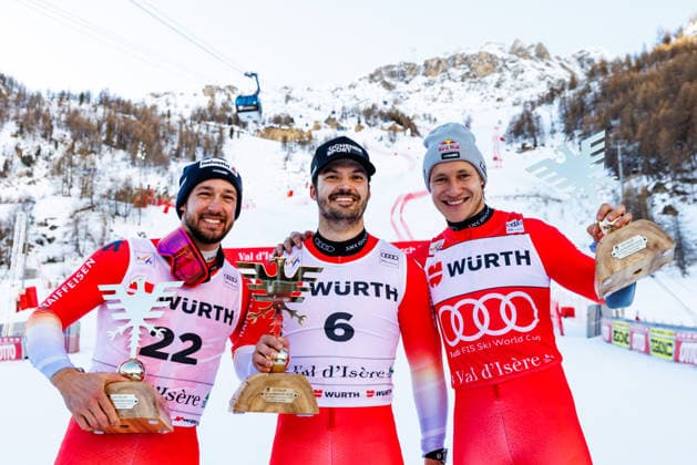 ALPINE SKIING - FIS WC Val D Isere VAL D ISERE,FRANCE,13.DEC.25 - ALPINE SKIING - FIS World Cup, giant slalom, men. Image shows the rejoicing of Luca Aerni (SUI), Loic Meillard (SUI) and Marco Odermatt (SUI). Keywords: trophy.  GEPAxpictures xMaticxKlansek