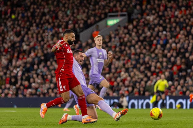 Football - FA Premier League - Liverpool FC v Brighton & Hove Albion FC LIVERPOOL, ENGLAND - Saturday, December 13, 2025: Liverpool s Mohamed Salah is challenged by Brighton & Hove Albion s captain Lewis Dunk during the FA Premier League match between Liverpool FC and Brighton & Hove Albion FC at Anfield. (Photo by David Rawcliffe Propaganda) LIVERPOOL Anfield MERSEYSIDE ENGLAND  Copyright: xDavidxRawcliffex P2025-12-13-Liverpool_Brighton-81
