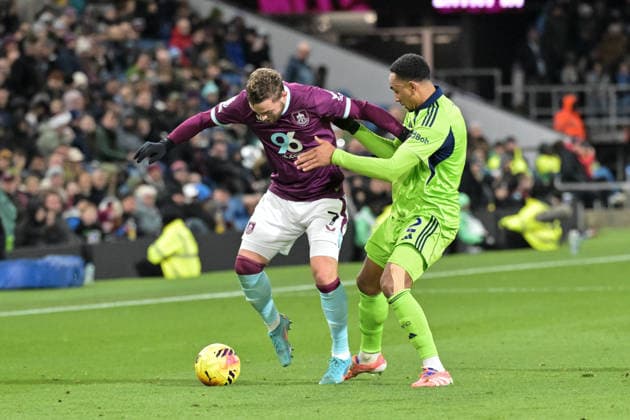 13th December 2025; Turf Moor, Burnley, Lancashire, England; Premier League Football, Burnley versus Fulham; Kenny Tete of Fulham tussles with Jacob Bruun Larsen of Burnley for the ball  LeexDurkin